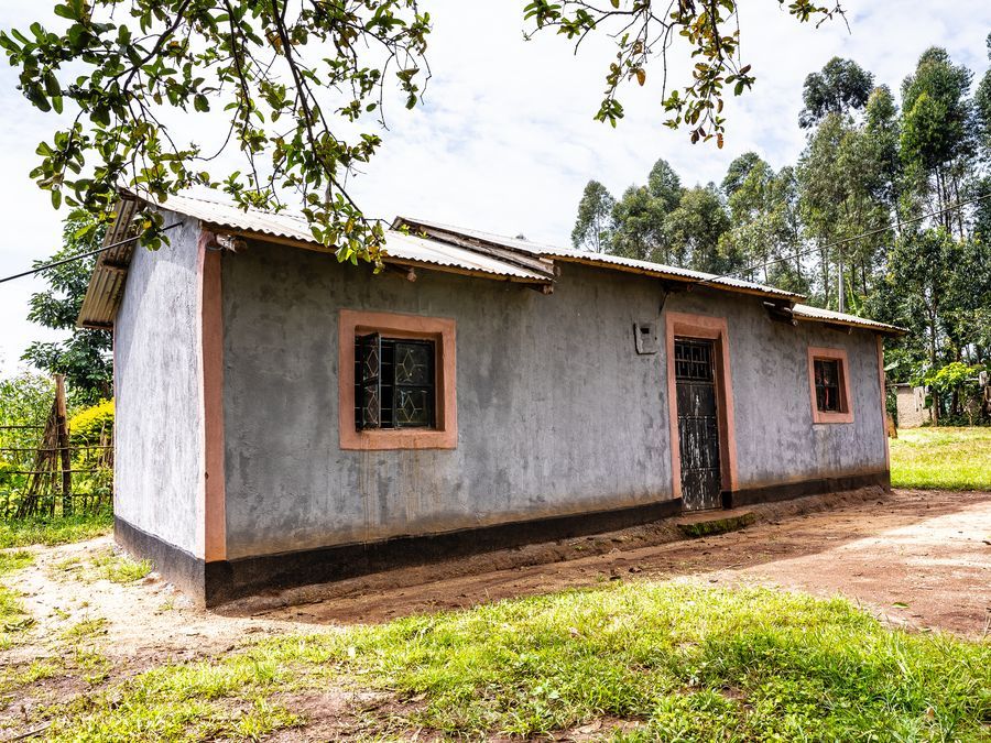 A newly completed earthen home with coral trim